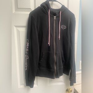 Harley Davison zip up in black with pink logos and draw strings. Size Medium.